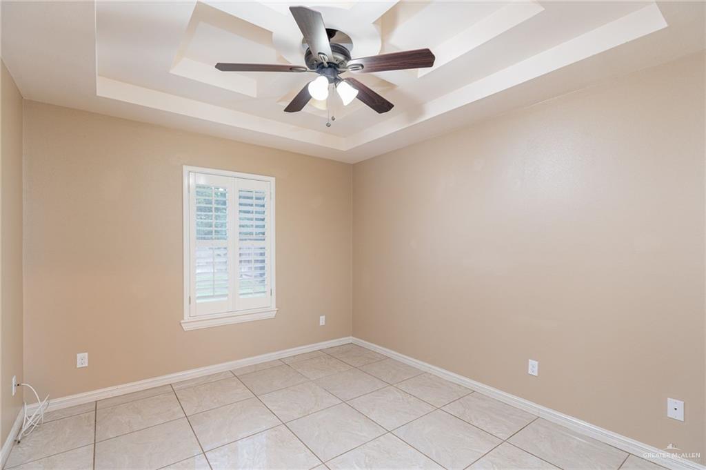 2112 Kilgore Avenue McAllen, TX 78504 - Photo 11 of 19 an empty room with windows and fan