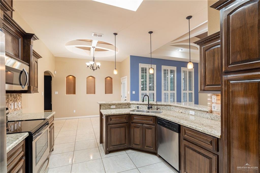 2112 Kilgore Avenue McAllen, TX 78504 - Photo 16 of 19 a kitchen with a sink and cabinets