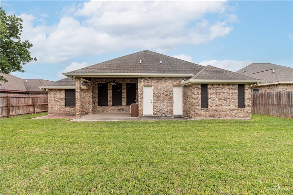 2112 Kilgore Avenue McAllen, TX 78504 - Photo 2 of 19 a front view of a house with a garden