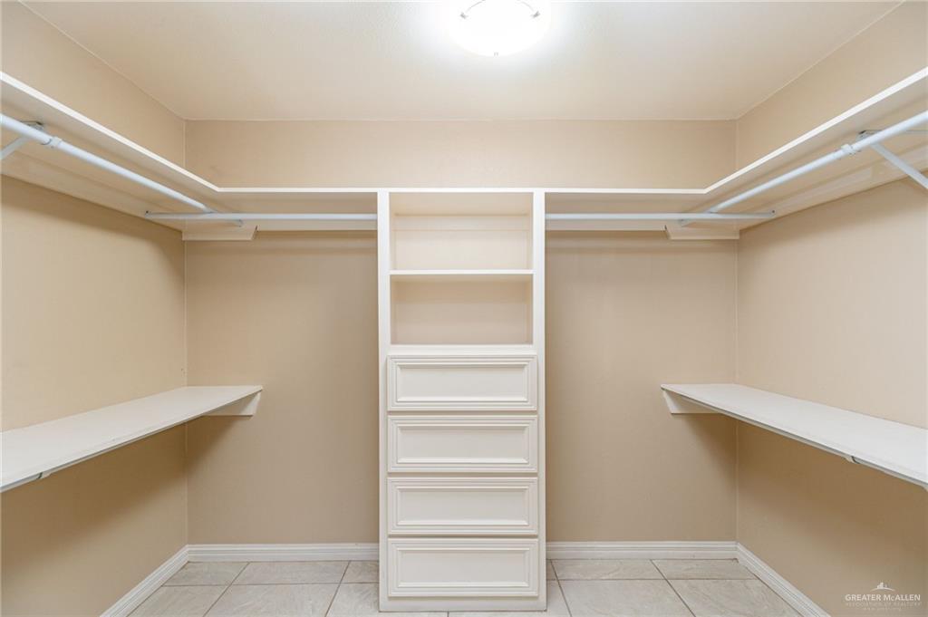 2112 Kilgore Avenue McAllen, TX 78504 - Photo 8 of 19 a view of walk in closet with empty racks