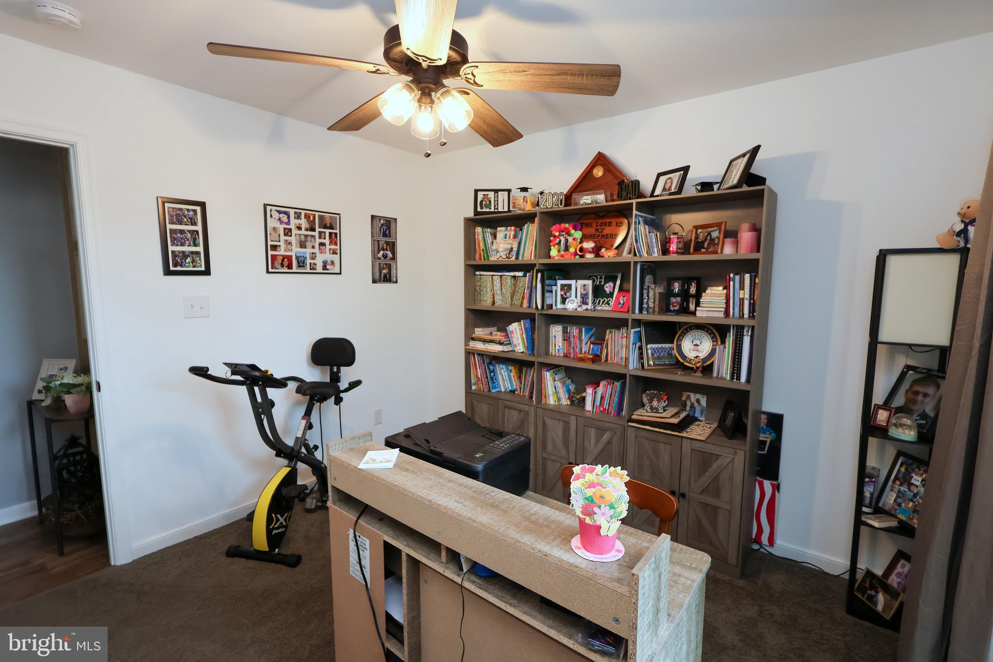16919 Shaffer Road Sharpsburg, MD 21782 - Photo 25 of 58 a view of a workspace with furniture and a book shelf