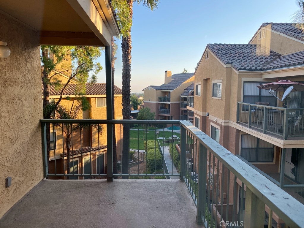 10655 Lemon Avenue, Unit 3509 Rancho Cucamonga, CA 91737 - Photo 12 of 15 a view of balcony with floor to ceiling window and wooden floor