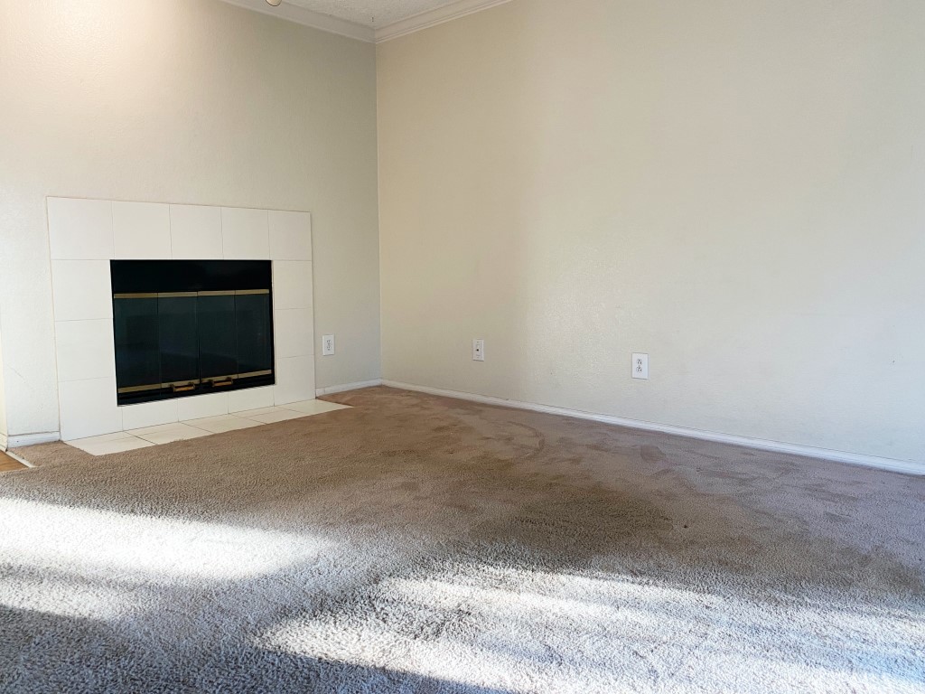 10655 Lemon Avenue, Unit 3509 Rancho Cucamonga, CA 91737 - Photo 3 of 15 a view of empty room with a fireplace