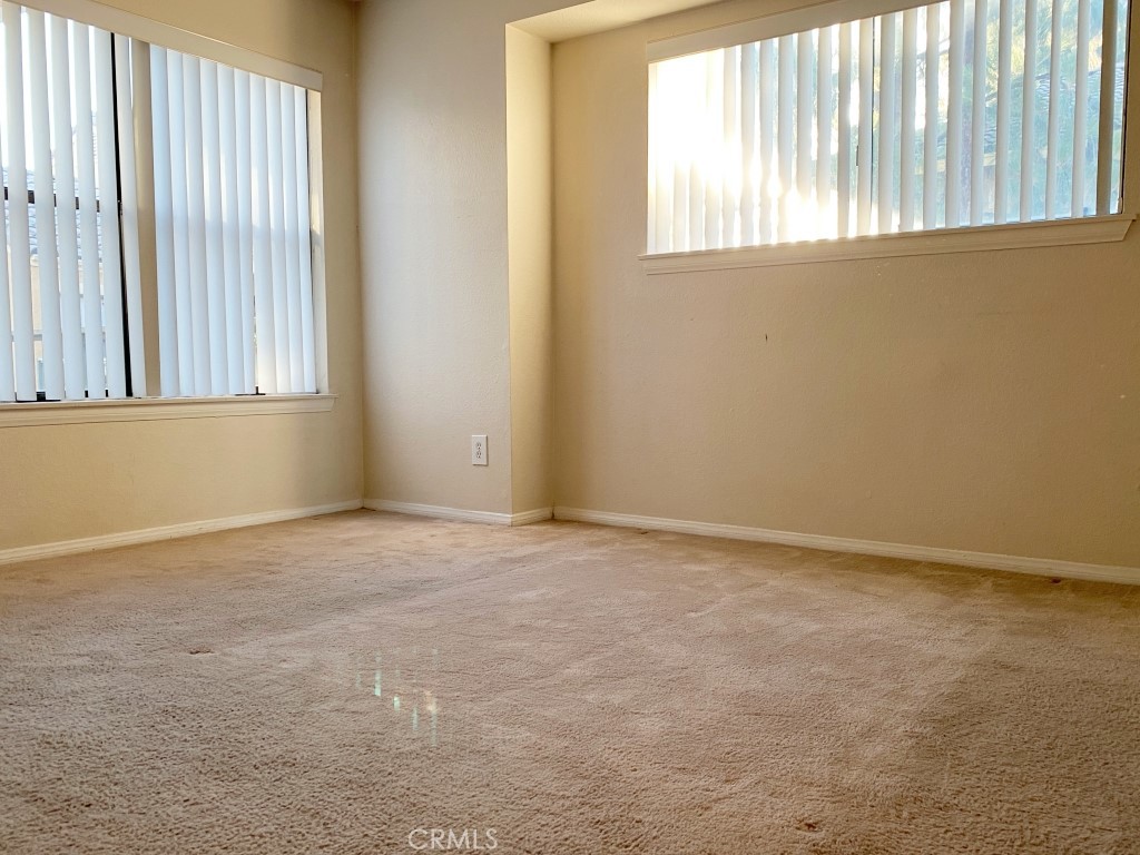 10655 Lemon Avenue, Unit 3509 Rancho Cucamonga, CA 91737 - Photo 4 of 15 an empty room with a window