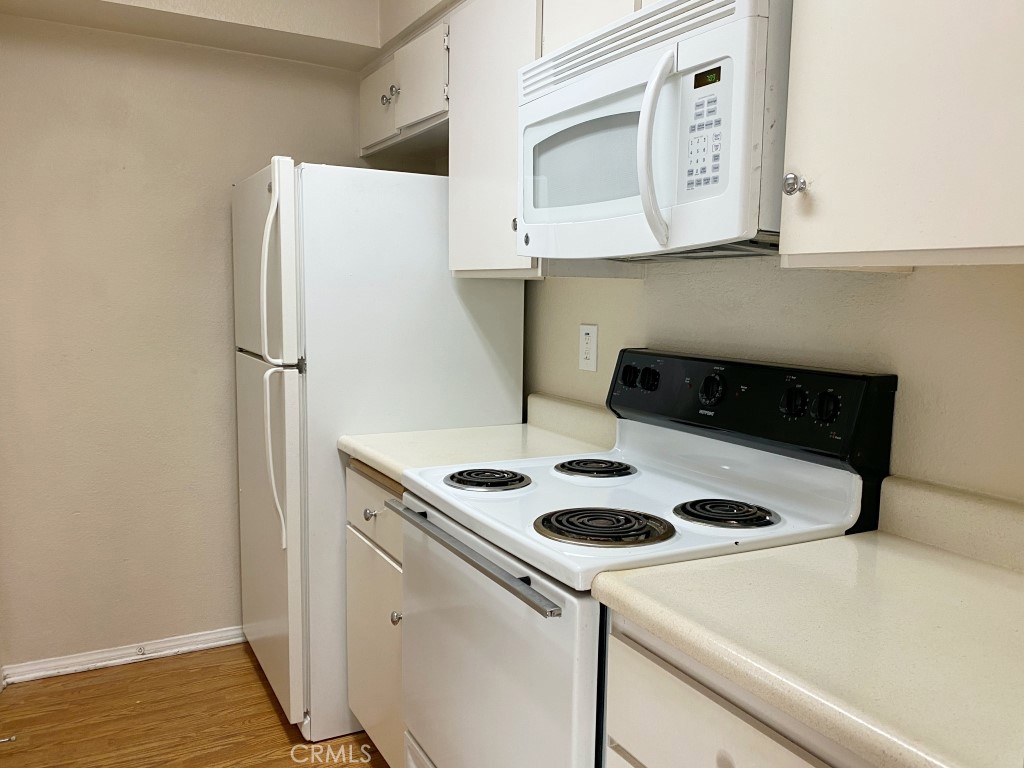 10655 Lemon Avenue, Unit 3509 Rancho Cucamonga, CA 91737 - Photo 7 of 15 a white refrigerator freezer sitting inside of a kitchen