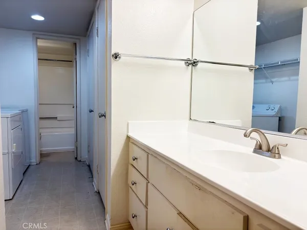a bathroom with a sink and a large mirror