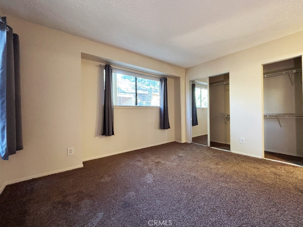10655 Lemon Avenue, Unit 3509 Rancho Cucamonga, CA 91737 - Photo 9 of 15 an empty room with windows