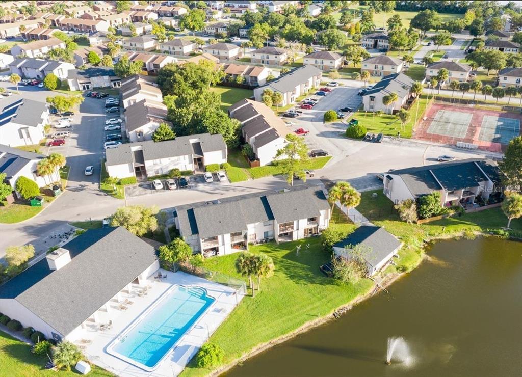 4033 Henley Road, Unit 1707 Orlando, FL 32839 - Photo 63 of 66 an aerial view of residential houses with swimming pool