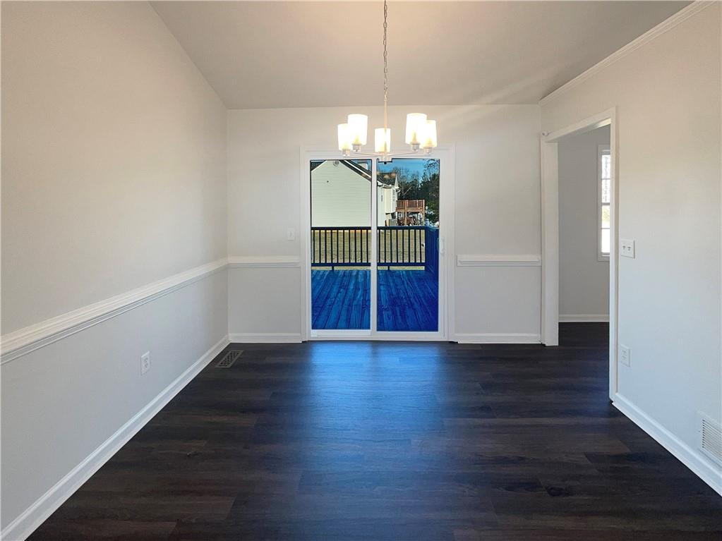 16 Fairview Glen Dallas, GA 30157 - Photo 13 of 26 a view of a room with wooden floor and chandelier