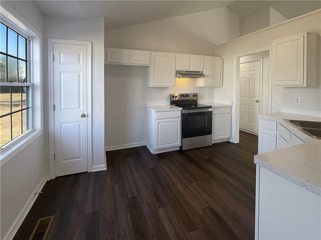 16 Fairview Glen Dallas, GA 30157 - Photo 14 of 26 a kitchen with a refrigerator and a stove top oven