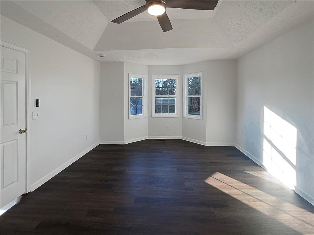 16 Fairview Glen Dallas, GA 30157 - Photo 16 of 26 an empty room with wooden floor and windows