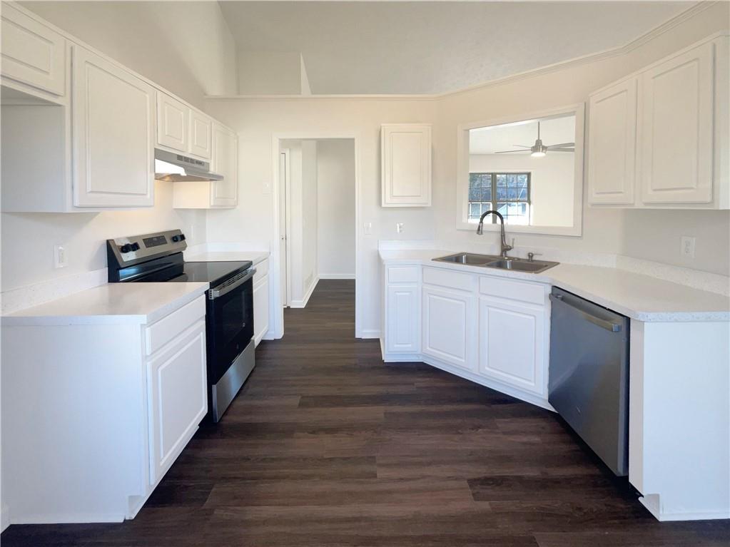 16 Fairview Glen Dallas, GA 30157 - Photo 2 of 26 a kitchen with granite countertop a stove top oven sink and cabinets