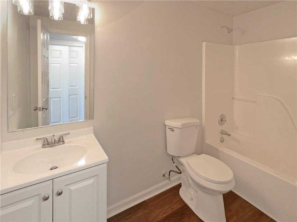16 Fairview Glen Dallas, GA 30157 - Photo 24 of 26 a white toilet sitting next to a bathroom sink