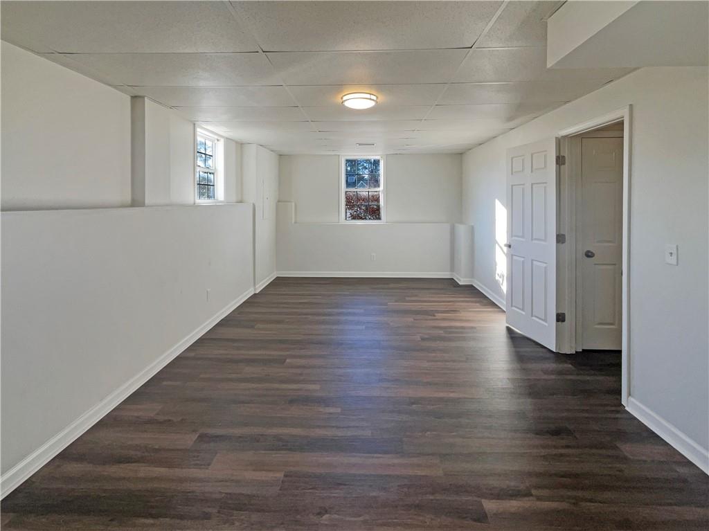 16 Fairview Glen Dallas, GA 30157 - Photo 25 of 26 an empty room with wooden floor and windows