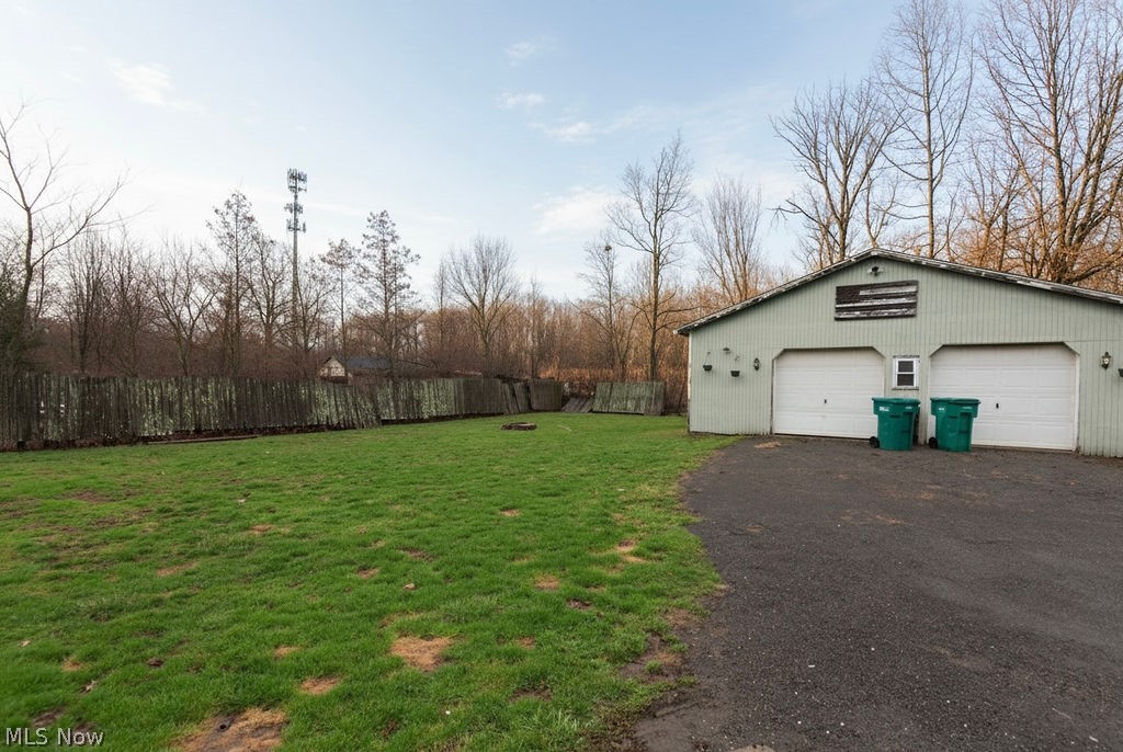 1195 South Johnson Road Sebring, OH 44672 - Photo 27 of 34 View of yard with a detached garage and an outbuilding