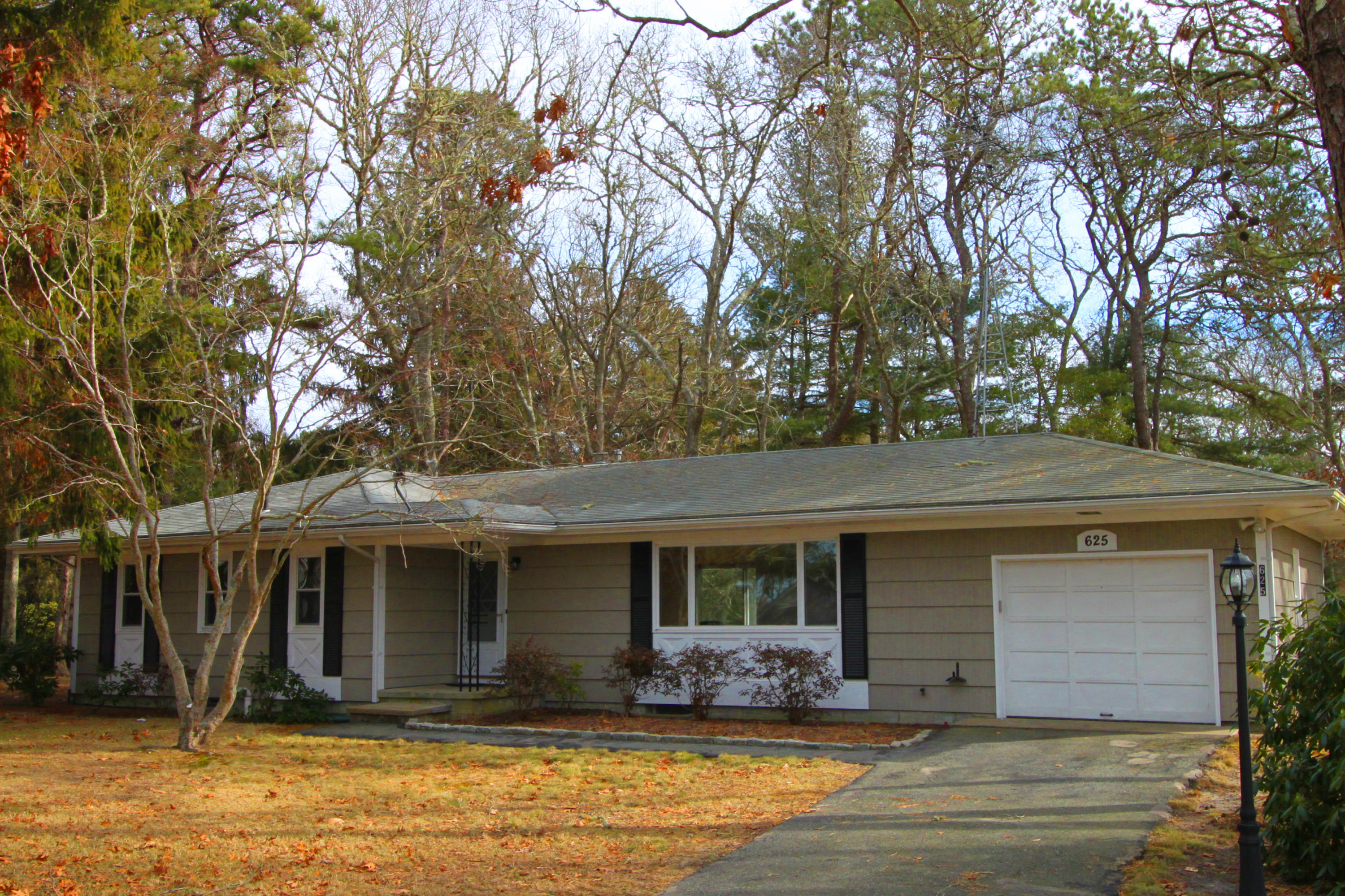 625 Poponessett Road Cotuit, MA 02635 - Photo 1 of 32 a front view of house with yard
