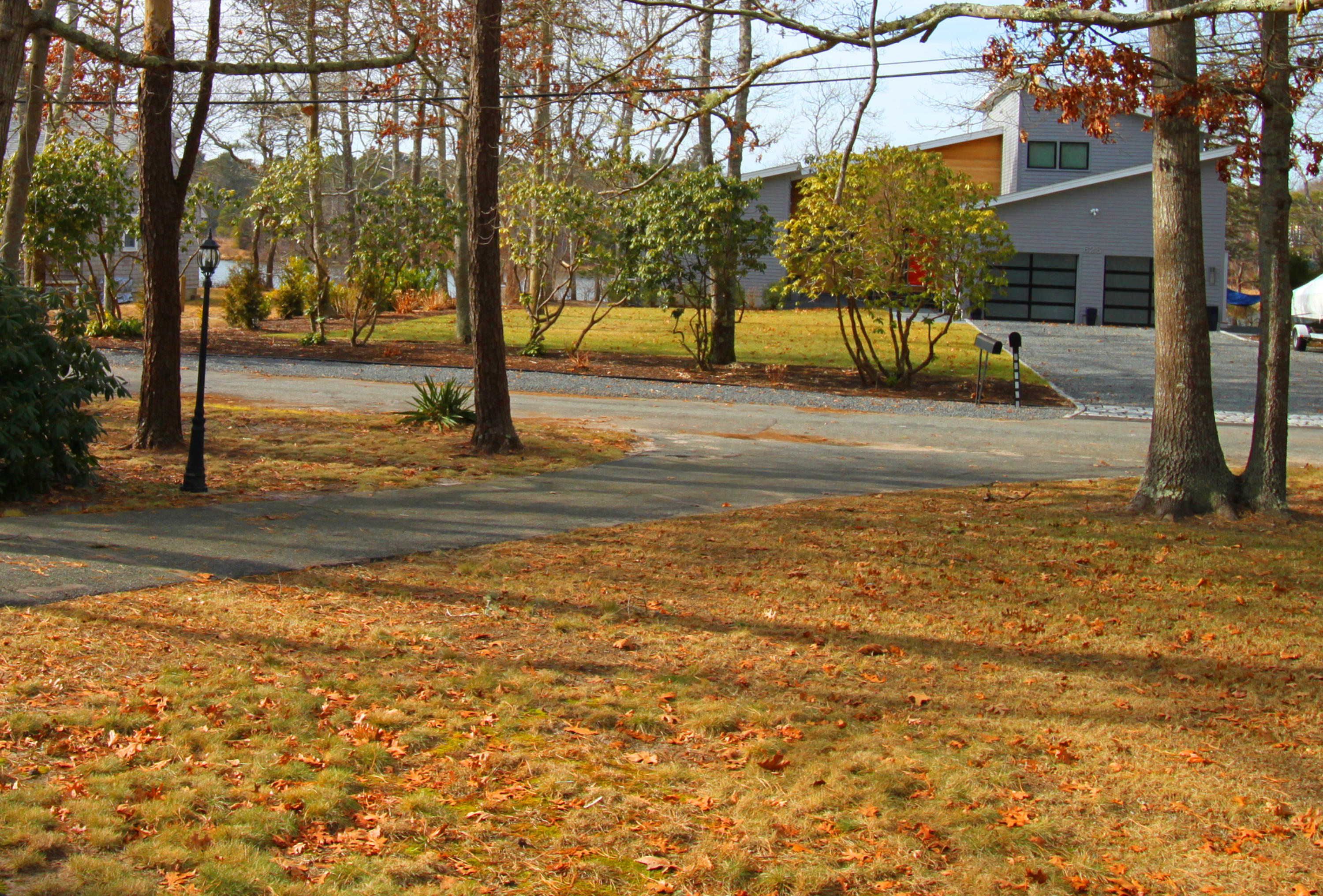 625 Poponessett Road Cotuit, MA 02635 - Photo 2 of 32 a view of yard with yellow house