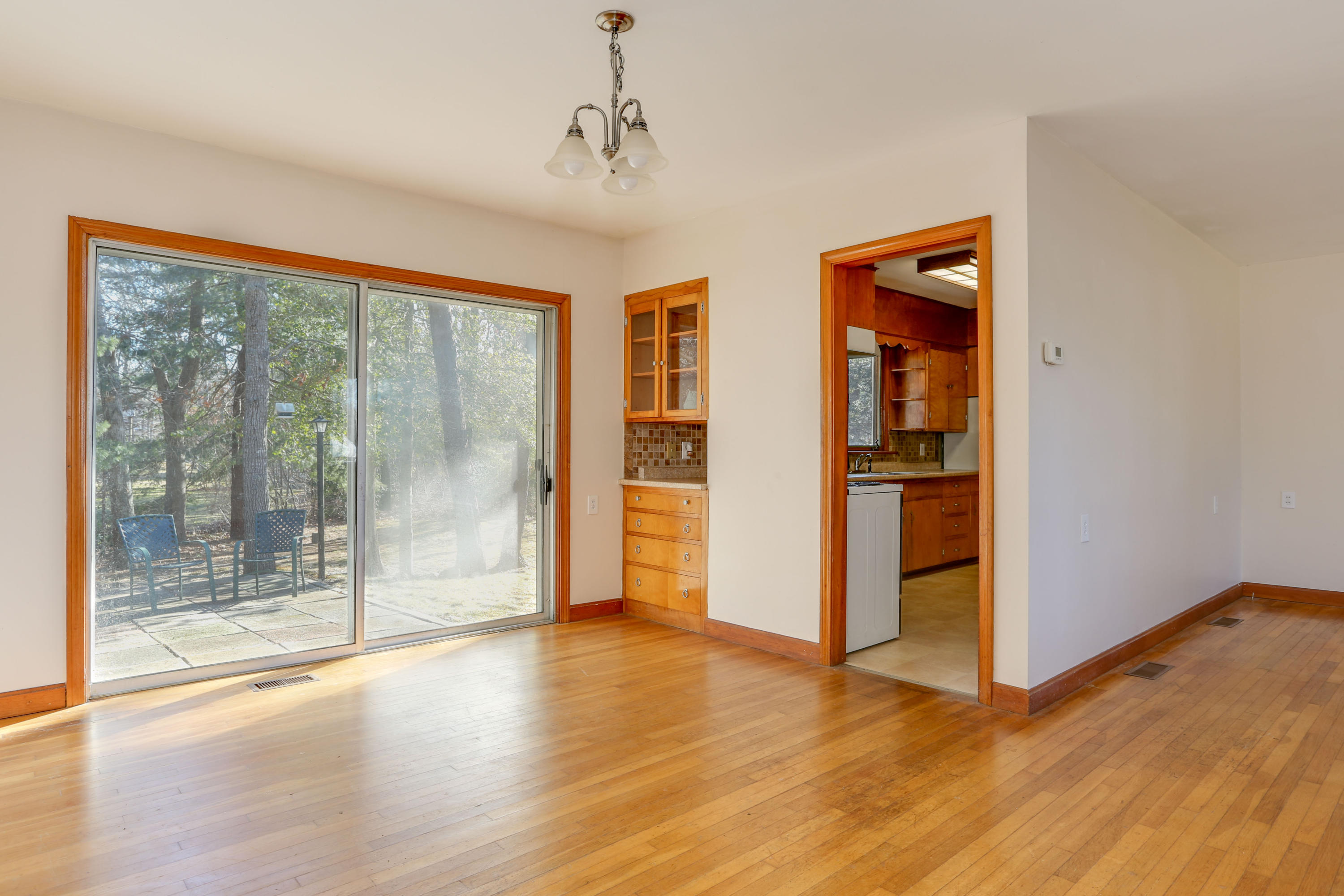 625 Poponessett Road Cotuit, MA 02635 - Photo 5 of 32 a view of empty room with wooden floor and fan