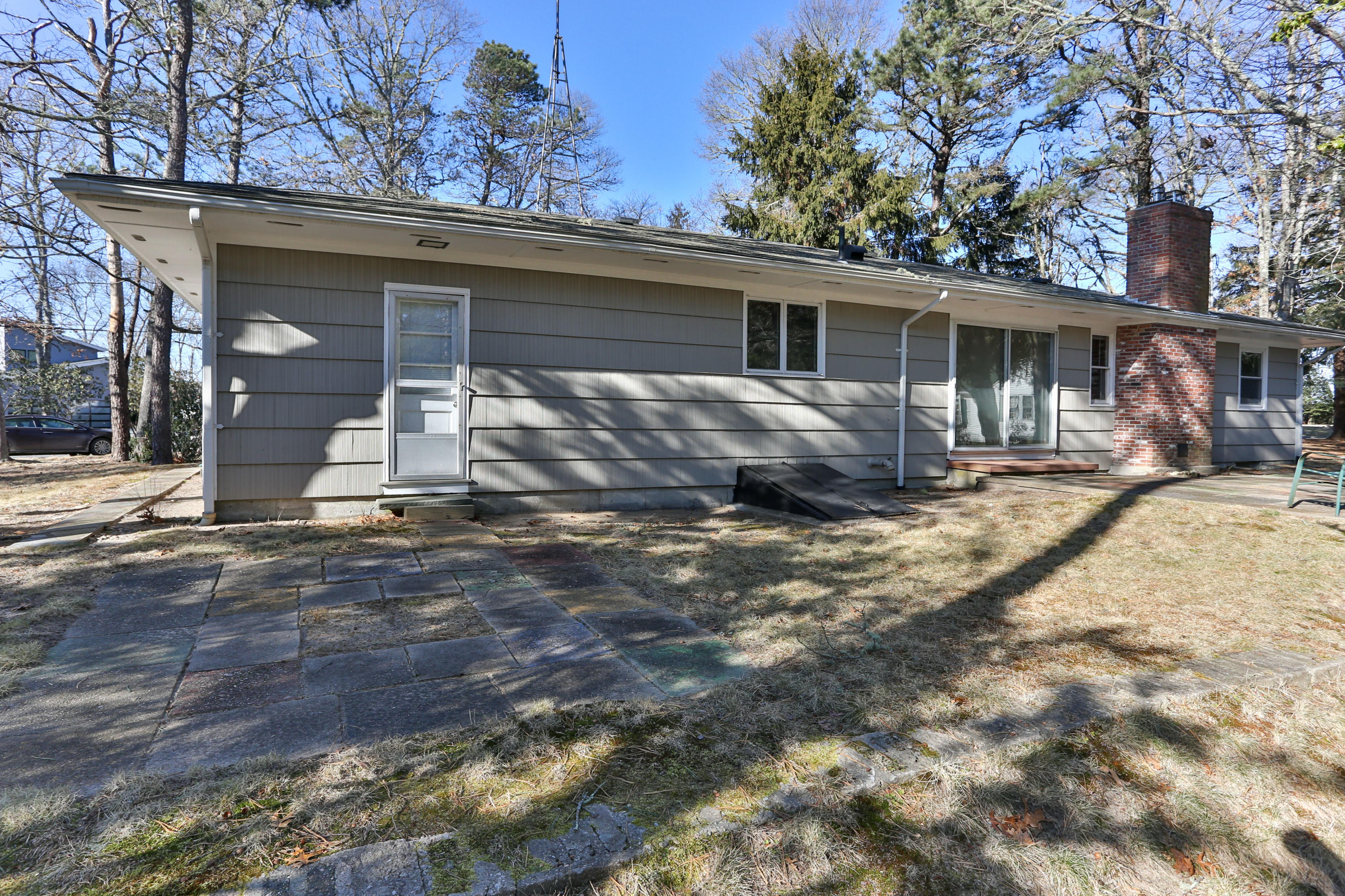 625 Poponessett Road Cotuit, MA 02635 - Photo 6 of 32 a view of a house with a yard