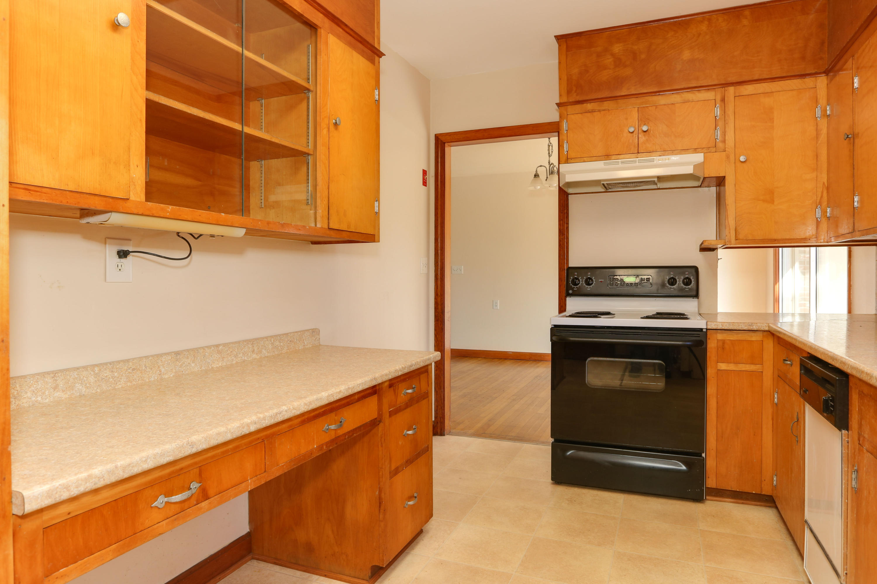 625 Poponessett Road Cotuit, MA 02635 - Photo 10 of 32 a kitchen with a refrigerator and a stove