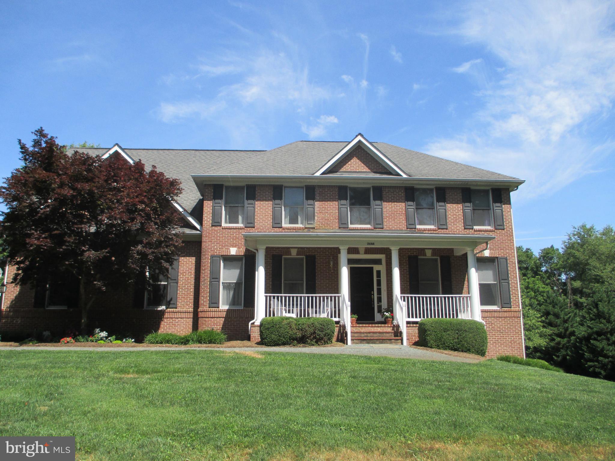All Brick home with inviting front porch