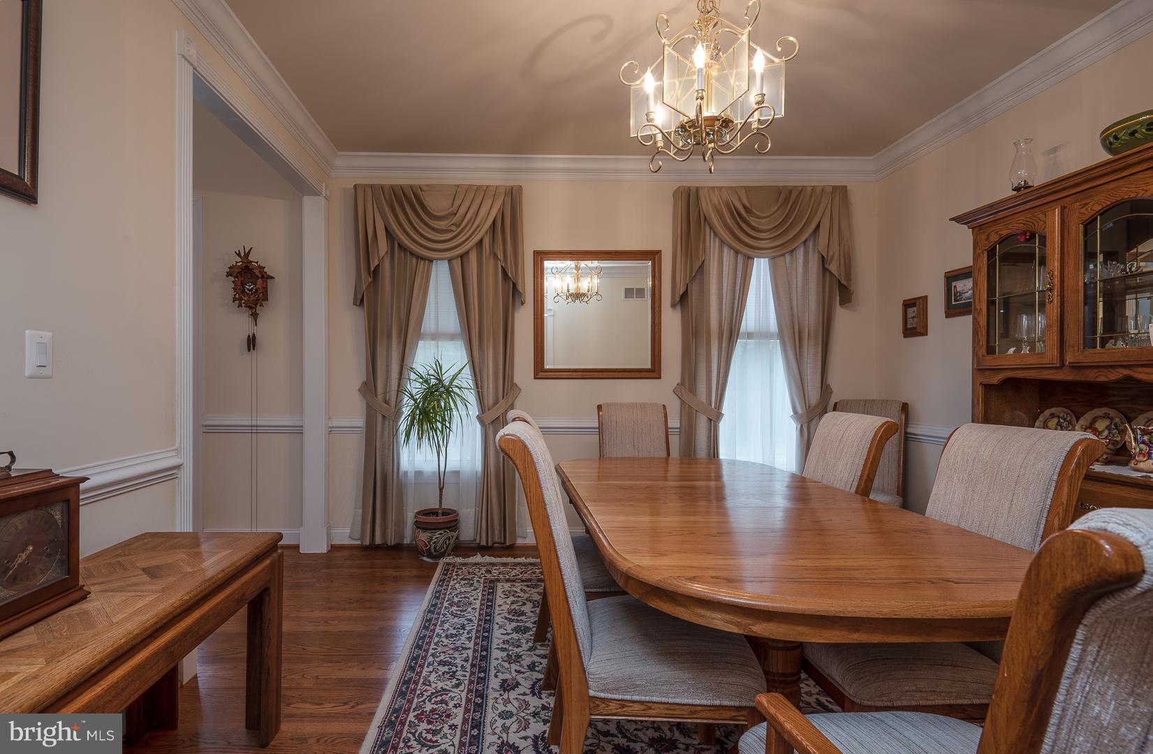 Spacious dining room with hardwood floors