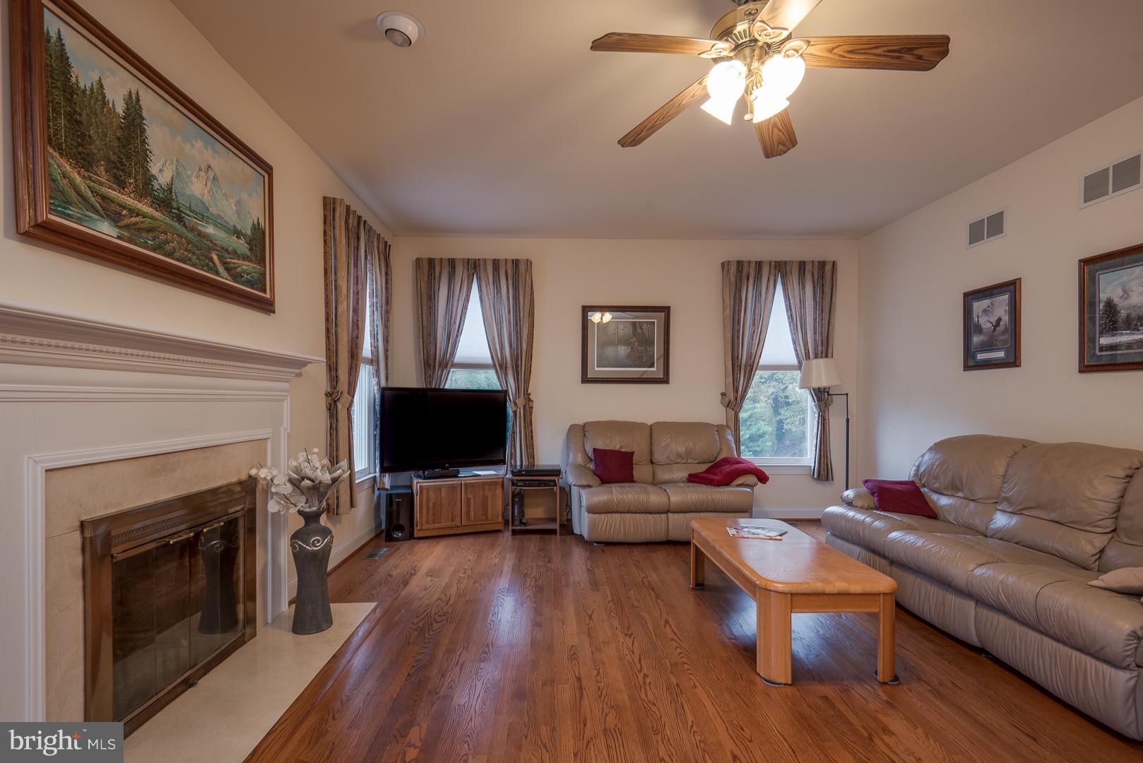 Spacious family room with hardwood floors