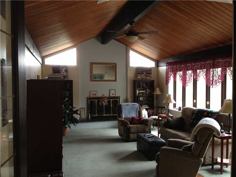 33 Forge Road North Kingstown, RI 02852 - Photo 3 of 24 Living Room. Formal living room with working fireplace (new flue), cathedral, tongue in groove ceilings; plenty of light streaming in; new carpeting.