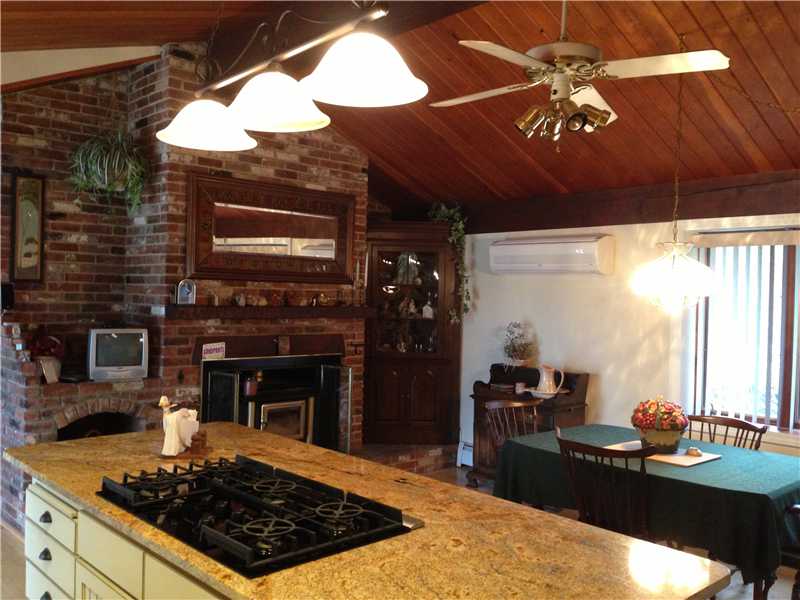 33 Forge Road North Kingstown, RI 02852 - Photo 6 of 24 Kitchen. 6 burner Thermidor with vented out fan; granite counter island; fireplace with wood stove; great as an eat in kitchen or country kitchen with family room