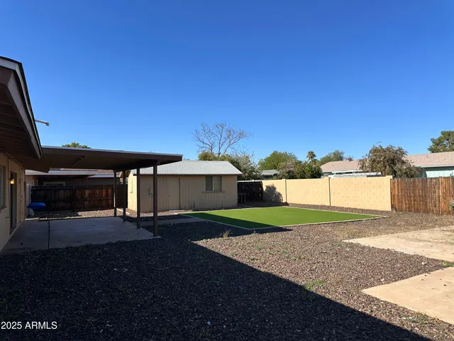 a view of a wooden house with a bench