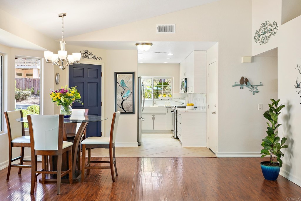 1848 Loreto Glen Escondido, CA 92027 - Photo 17 of 43 a view of a dining room with furniture and wooden floor