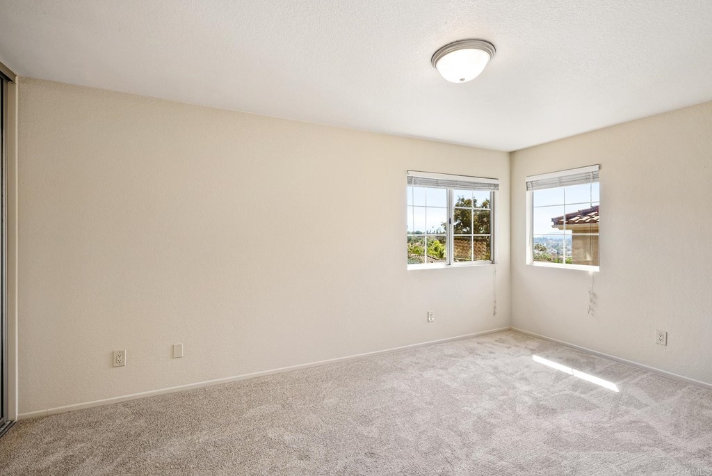 1848 Loreto Glen Escondido, CA 92027 - Photo 25 of 43 an empty room with windows