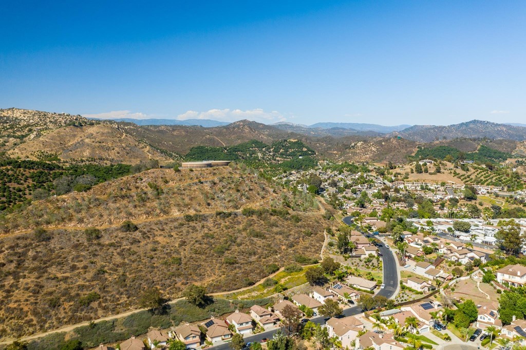 1848 Loreto Glen Escondido, CA 92027 - Photo 37 of 43 a view of a field with mountains in the background