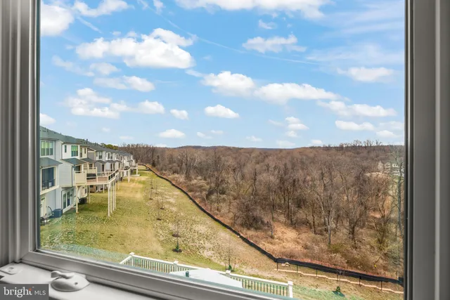 a bedroom with a bed and a flat tv screen