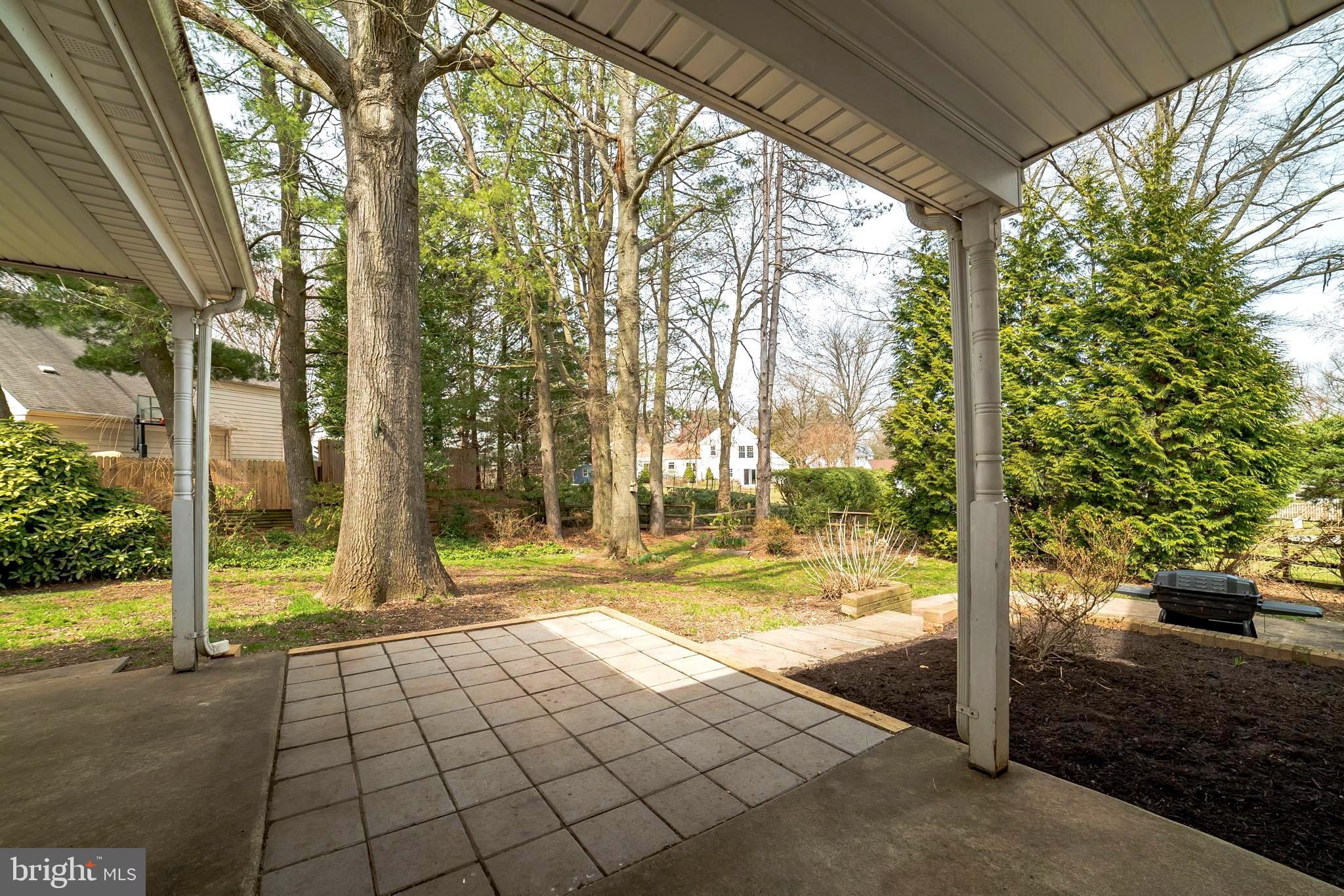 2413 Countryside Drive Silver Spring, MD 20905 - Photo 26 of 30 Covered Patio Overlooks Backyard