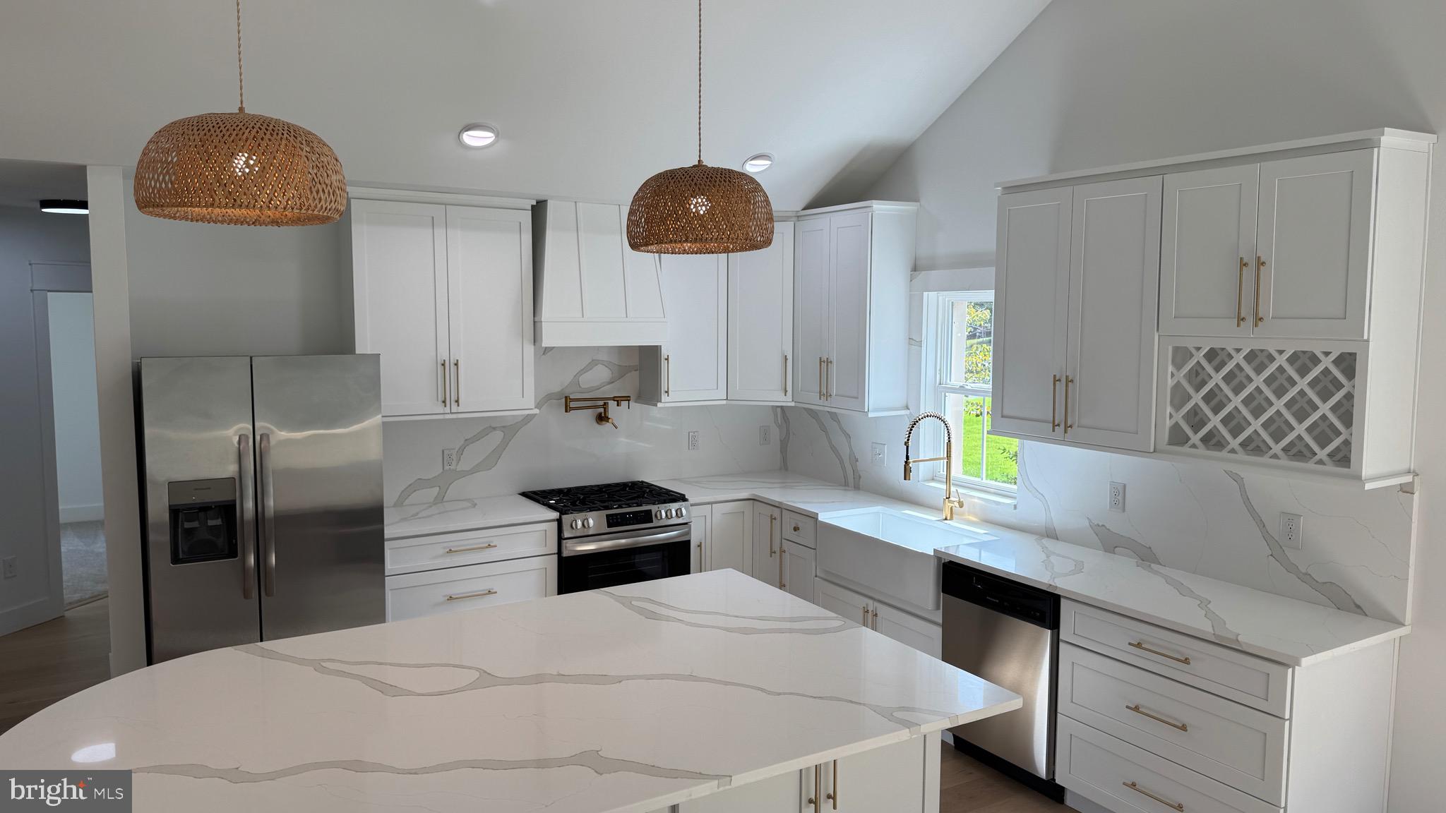 340 Honeymoon Road Glassboro, NJ 08028 - Photo 21 of 110 a kitchen with stainless steel appliances kitchen island granite countertop a sink a stove and a refrigerator