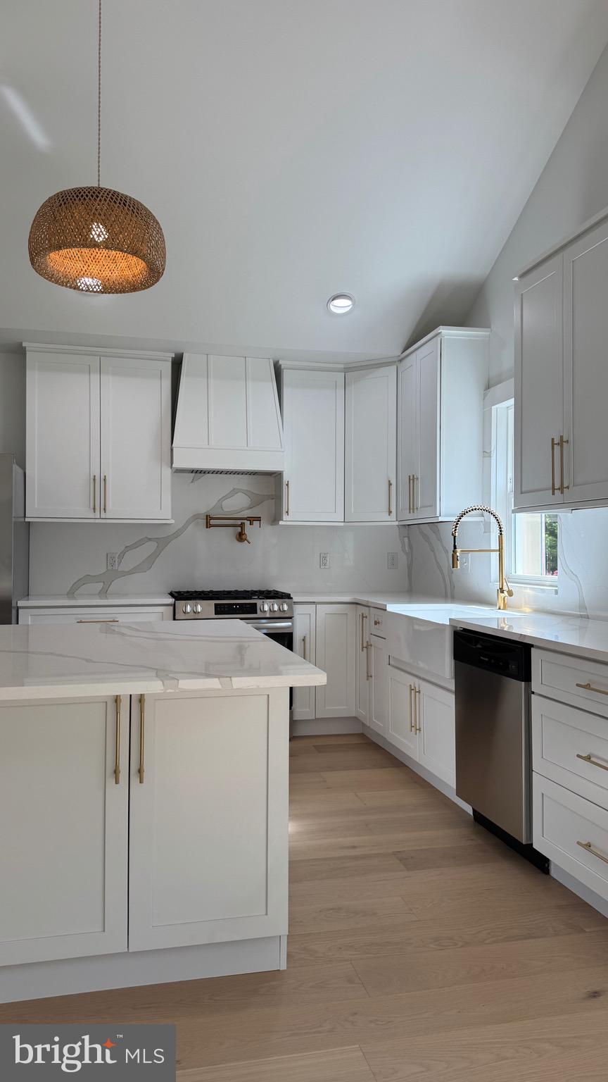 340 Honeymoon Road Glassboro, NJ 08028 - Photo 23 of 110 a kitchen with stainless steel appliances granite countertop a stove a sink a refrigerator and white cabinets