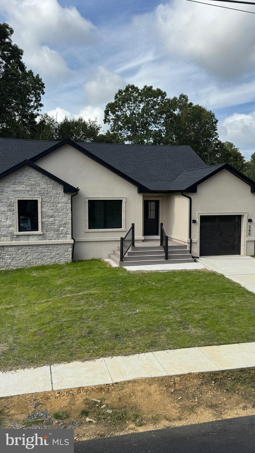 340 Honeymoon Road Glassboro, NJ 08028 - Photo 3 of 110 a front view of a house with a yard