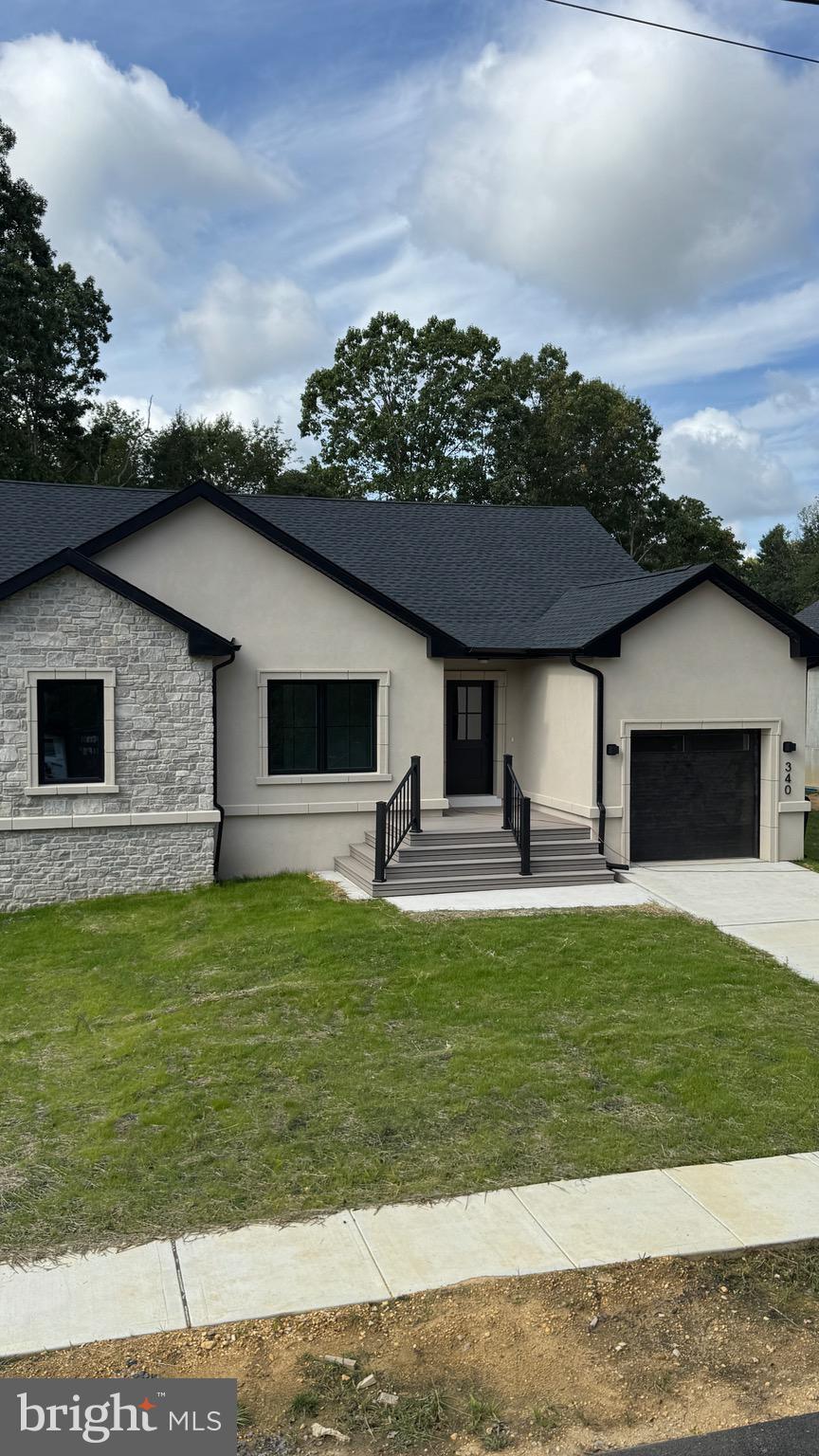 340 Honeymoon Road Glassboro, NJ 08028 - Photo 5 of 110 a front view of a house with a yard