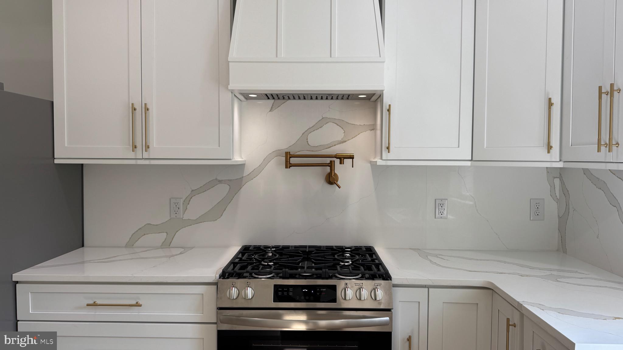340 Honeymoon Road Glassboro, NJ 08028 - Photo 56 of 110 a kitchen with white cabinets and appliances