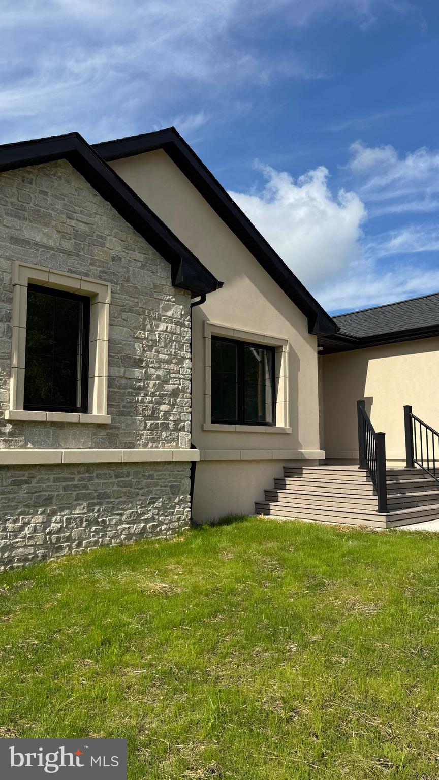 340 Honeymoon Road Glassboro, NJ 08028 - Photo 8 of 110 a front view of a house with garden