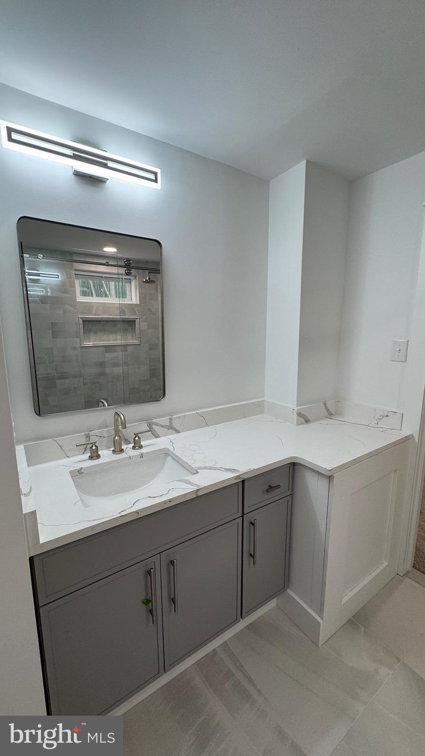 340 Honeymoon Road Glassboro, NJ 08028 - Photo 86 of 110 a bathroom with a sink and mirror