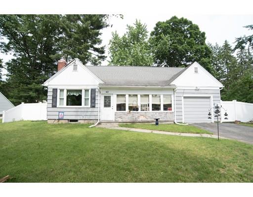 42 Piper Road West Springfield, MA 01089 - Photo 3 of 35 a front view of a house with a yard and trees