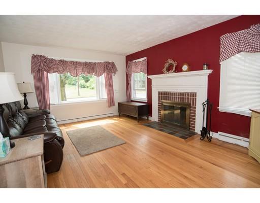 42 Piper Road West Springfield, MA 01089 - Photo 6 of 35 a living room with furniture a fireplace and a large window