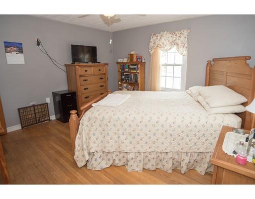 42 Piper Road West Springfield, MA 01089 - Photo 10 of 35 a bedroom with a bed and a flat tv screen on dresser