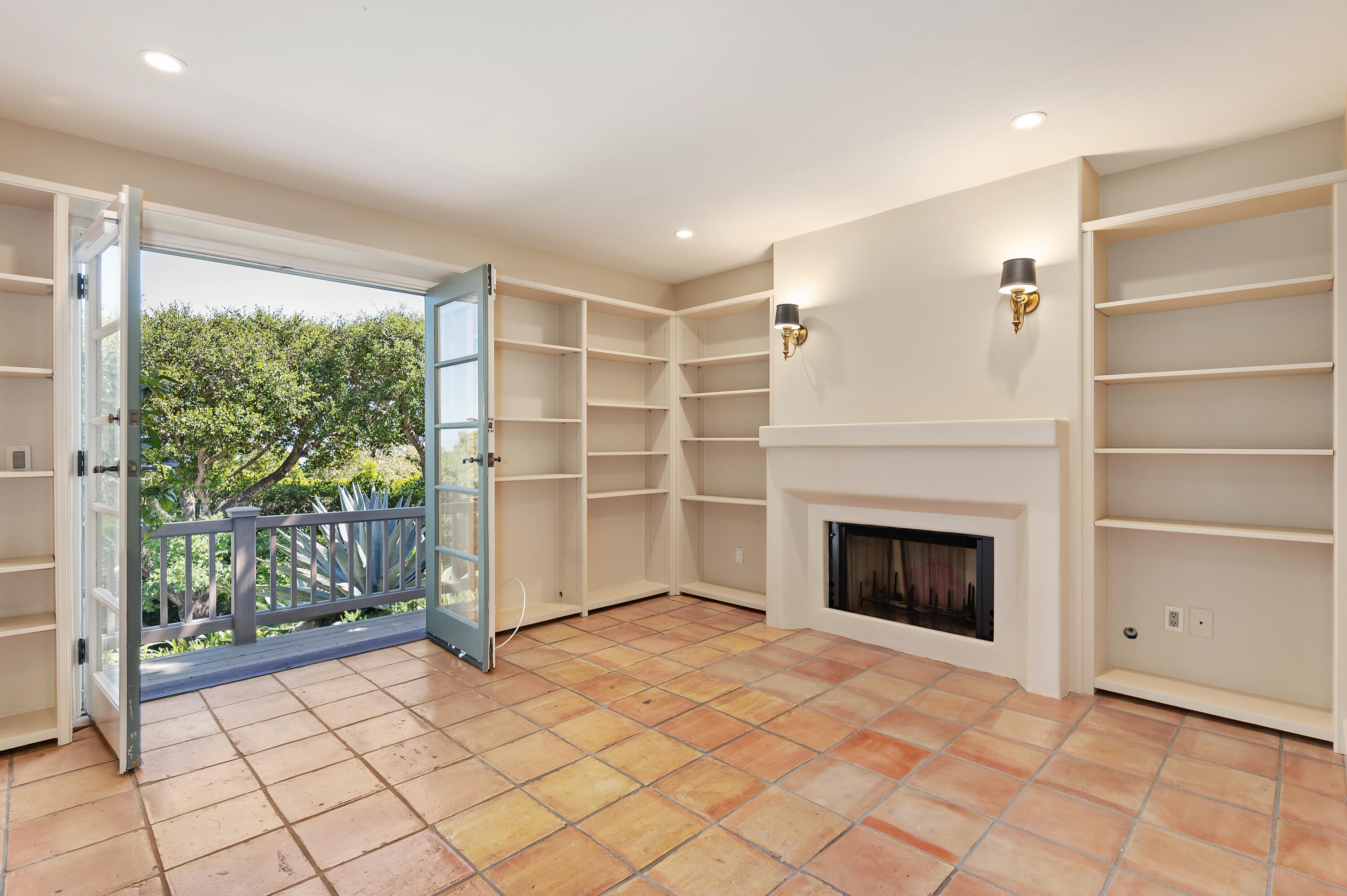 931 Knapp Drive Santa Barbara, CA 93108 - Photo 16 of 40 a view of an empty room with a fireplace and a window
