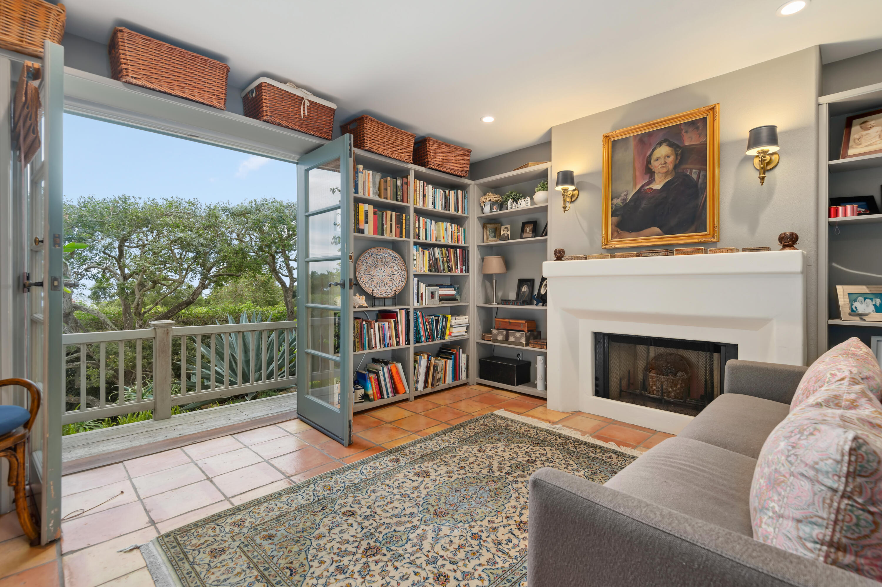 931 Knapp Drive Santa Barbara, CA 93108 - Photo 17 of 40 a living room with furniture a fireplace and a floor to ceiling window