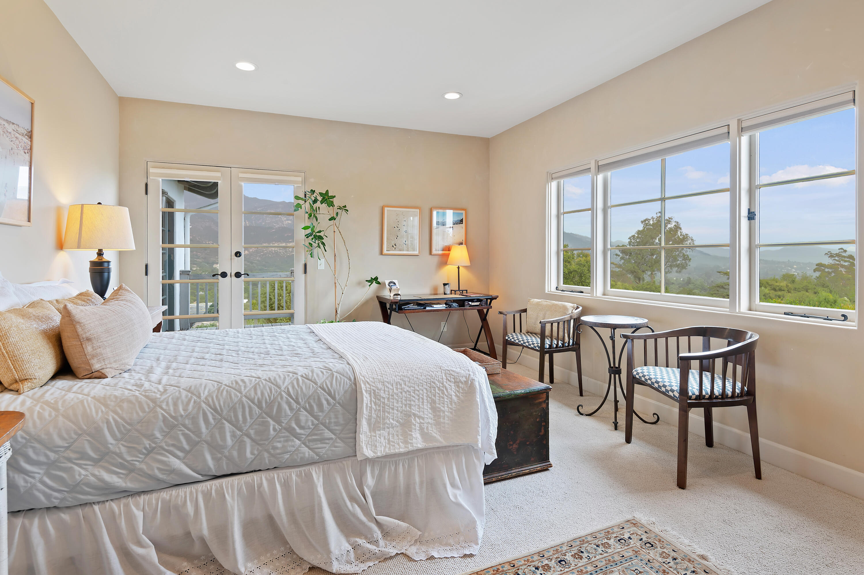 931 Knapp Drive Santa Barbara, CA 93108 - Photo 26 of 40 a bedroom with a bed a table and a large window