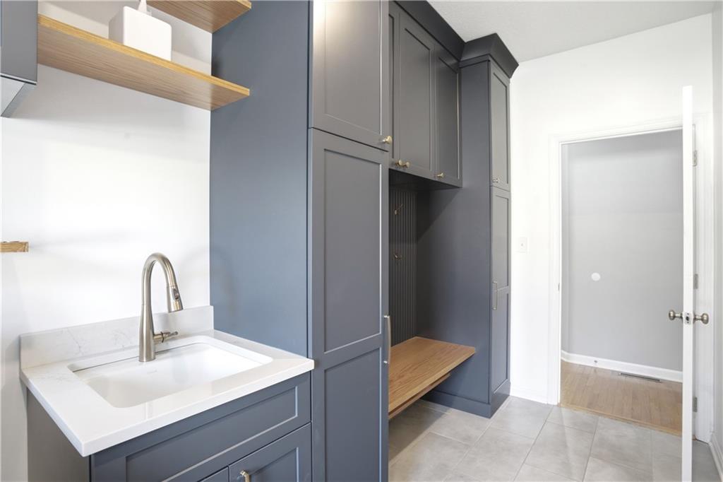 237 Morning Grove Lane Valencia, PA 16059 - Photo 21 of 50 Newly updated laundry/mud room area has upgraded cabinetry, laundry sink, shelving