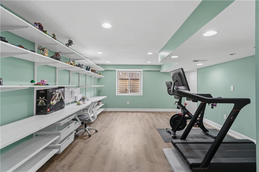 237 Morning Grove Lane Valencia, PA 16059 - Photo 41 of 50 Lower level has egress window for natural light, full storage room, exercise space and Elfa shelving. Newer LVT flooring througout lower level.